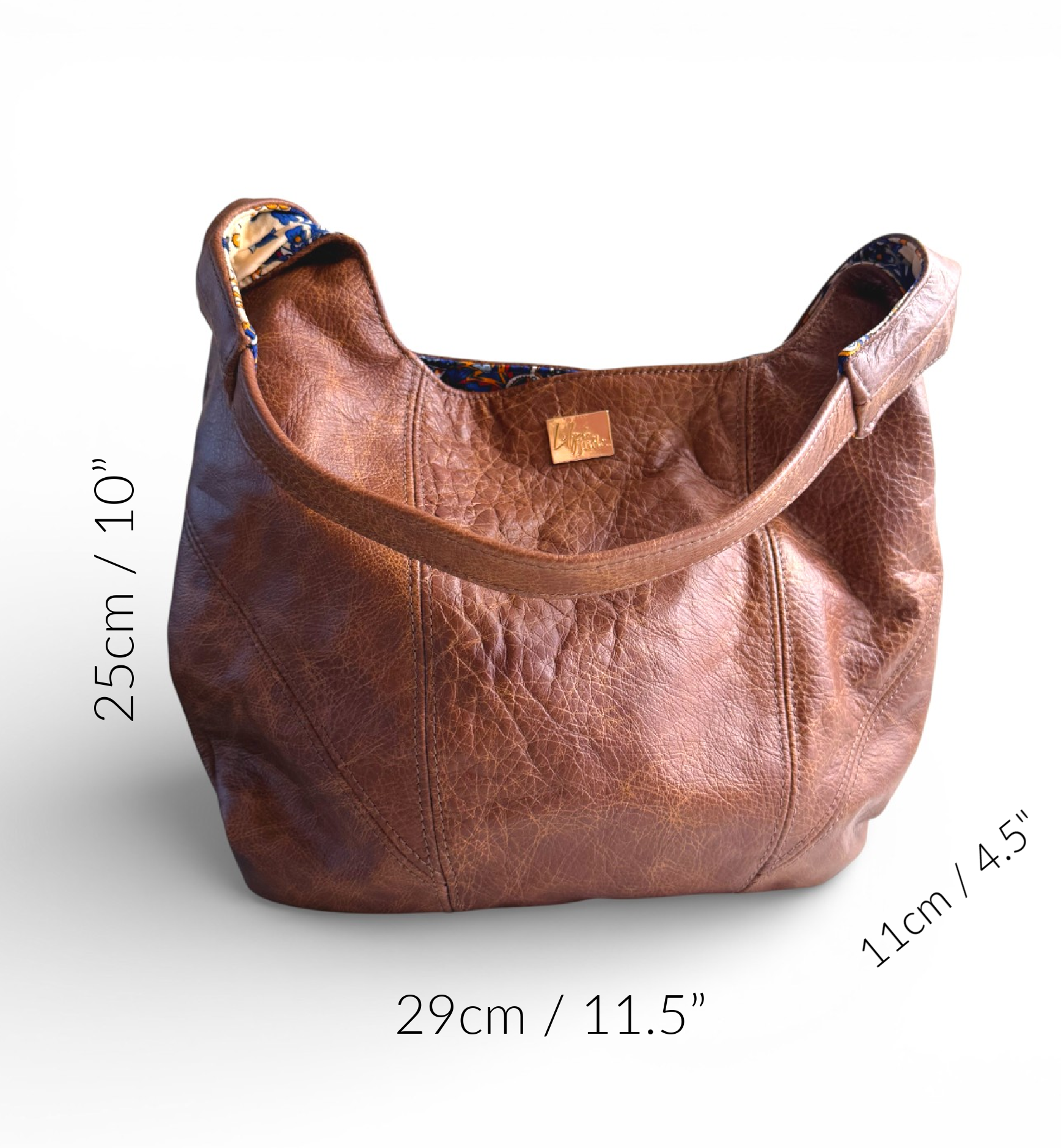 Brown leather Estrella handbag with measurements on a white background