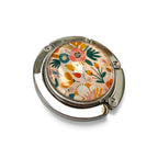 Floral patterned handbag hanger on a white background