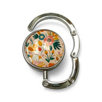 Floral-patterned handbag holder on a white background