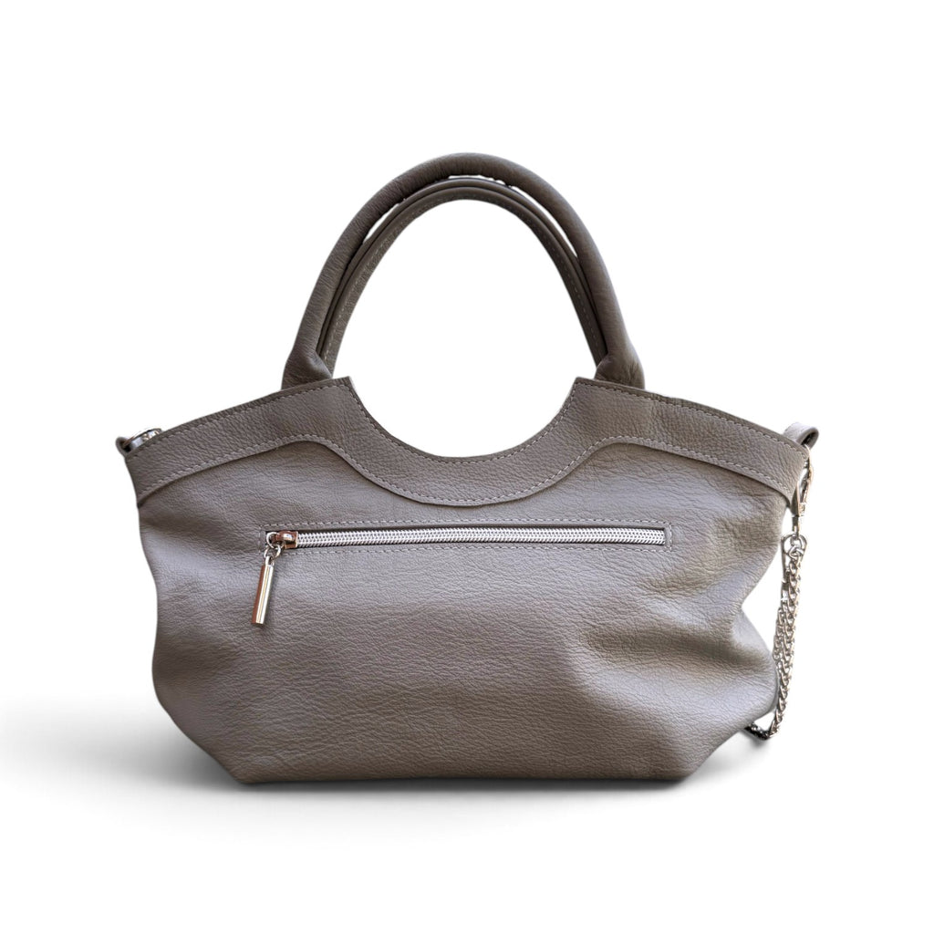 A grey pebbled leather handbag with dual top handles, a front zippered pocket, and a silver chain detail, shown against a plain white background.