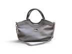A gray leather handbag with a silver chain strap and a small silver-tone logo plaque, shown on a plain white background.