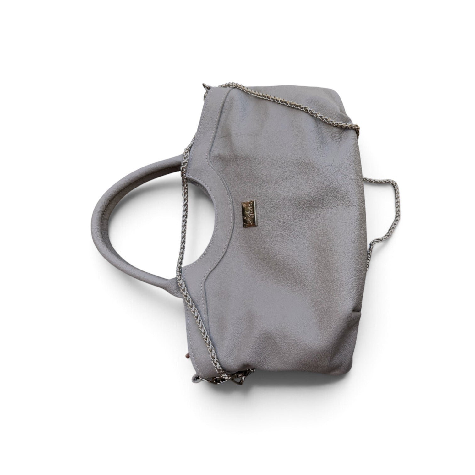 A grey pebbled leather handbag with a top handle, silver chain strap, and a small silver-tone logo plaque, shown lying down on a white background.