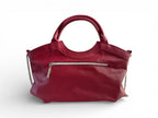 Rear view of the red leather Flossy handbag with a chain detail on a white background. The image highlights the zipper pocket on the back of the bag