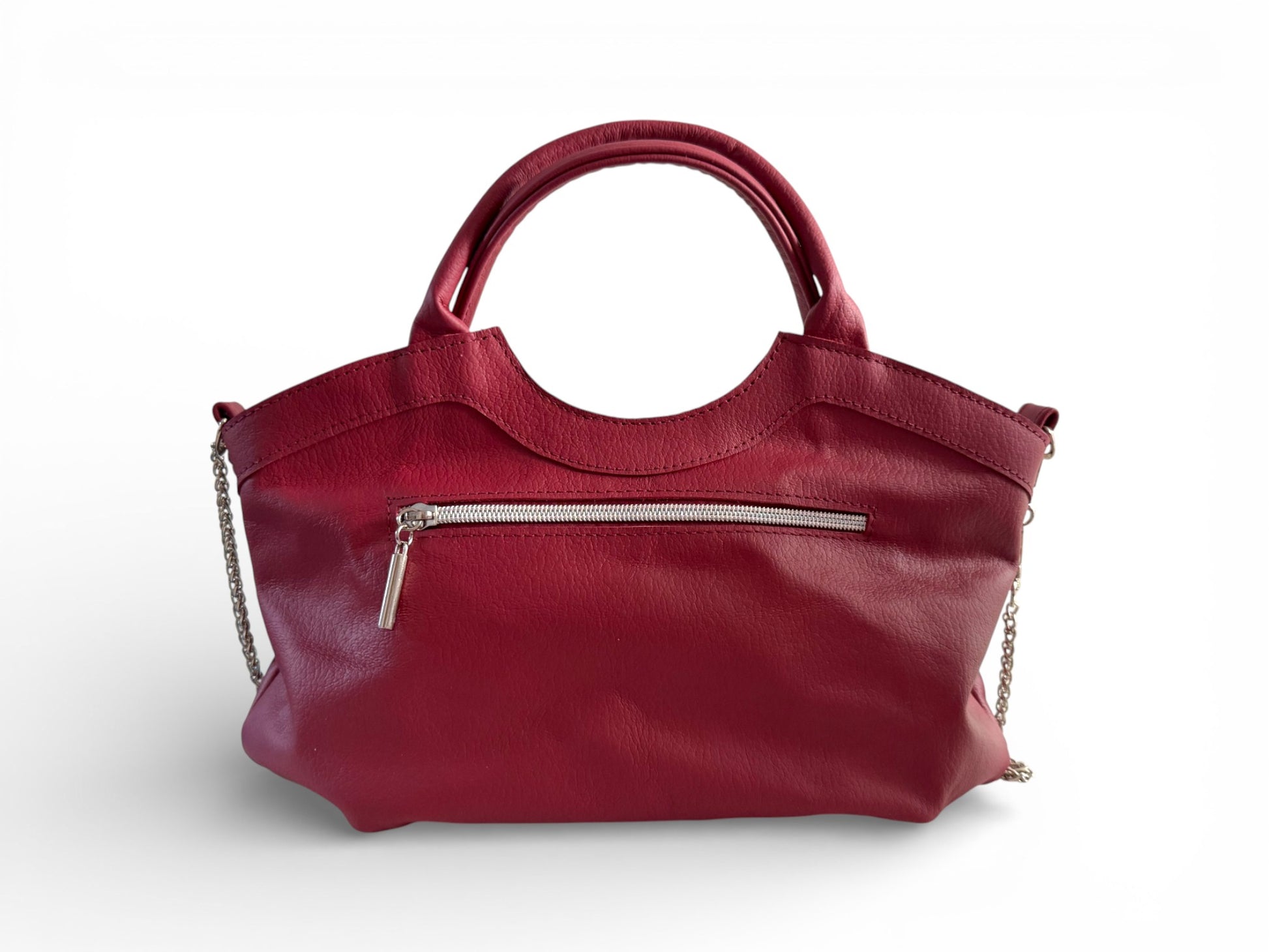 Rear view of the red leather Flossy handbag with a chain detail on a white background. The image highlights the zipper pocket on the back of the bag