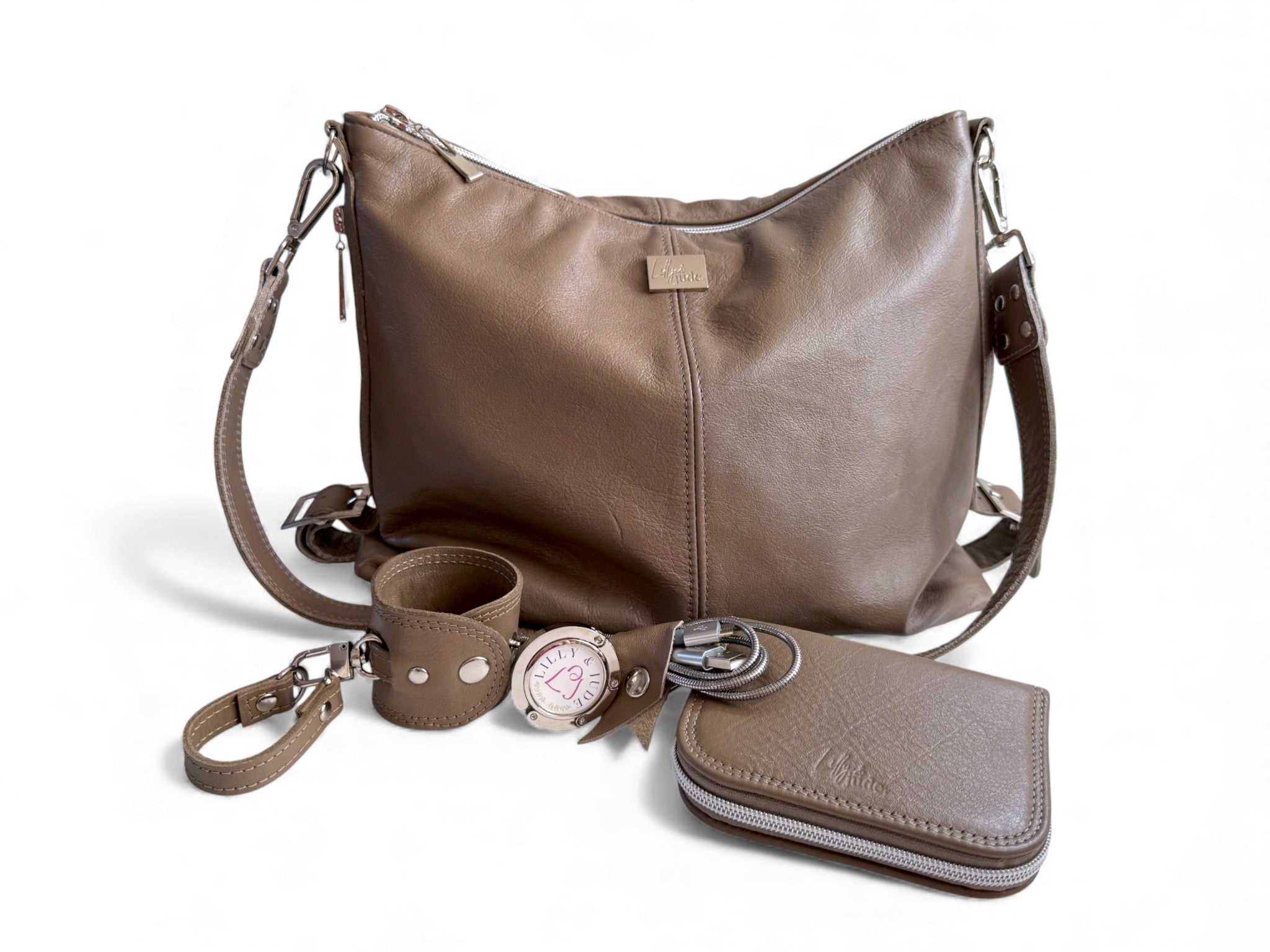 Taupe leather handbag with matching wallet and keychain on a white background