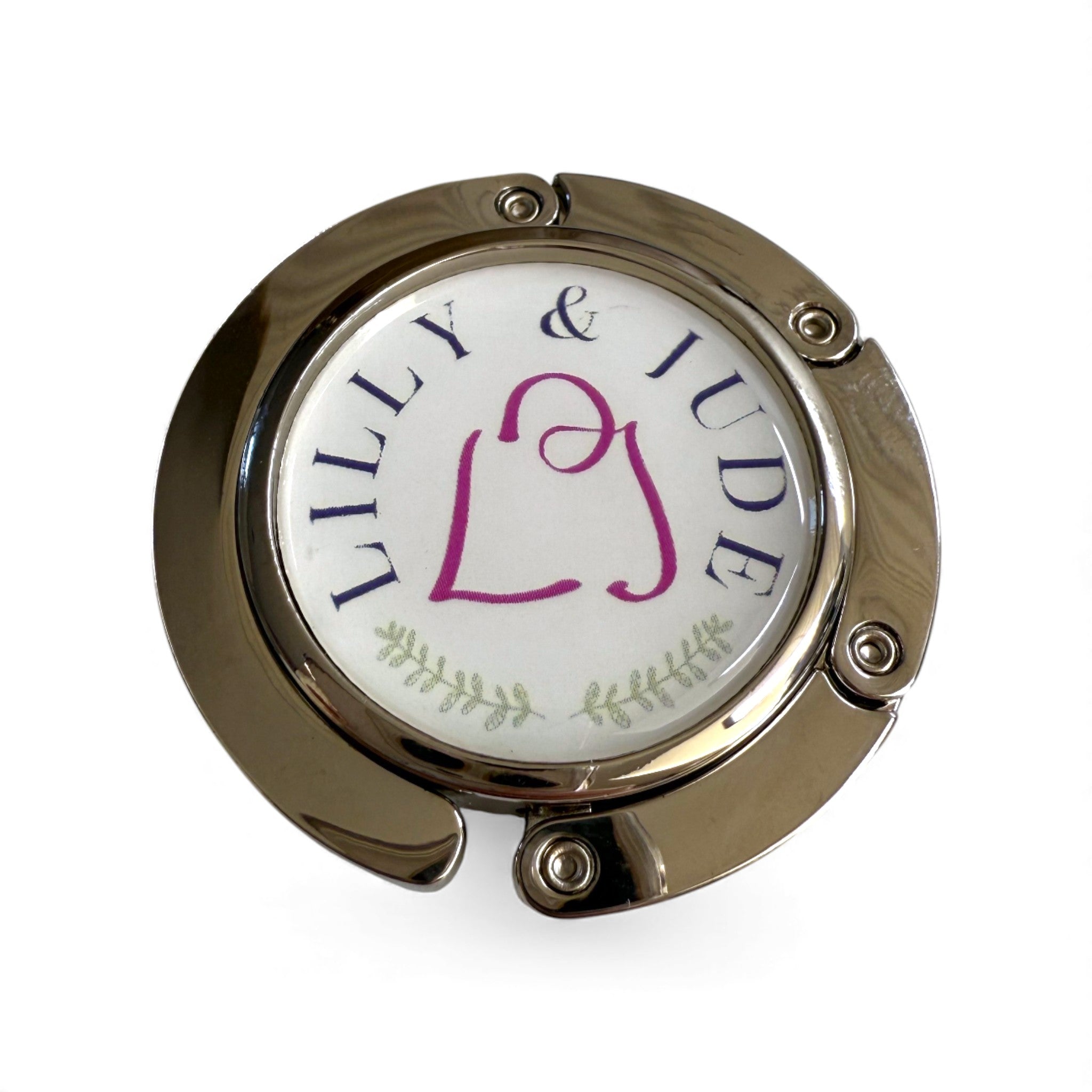 Round metal folding handbag hook with 'LILLY & JUDE' branding on a white background