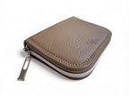 Taupe leather zippered pouch on a white background