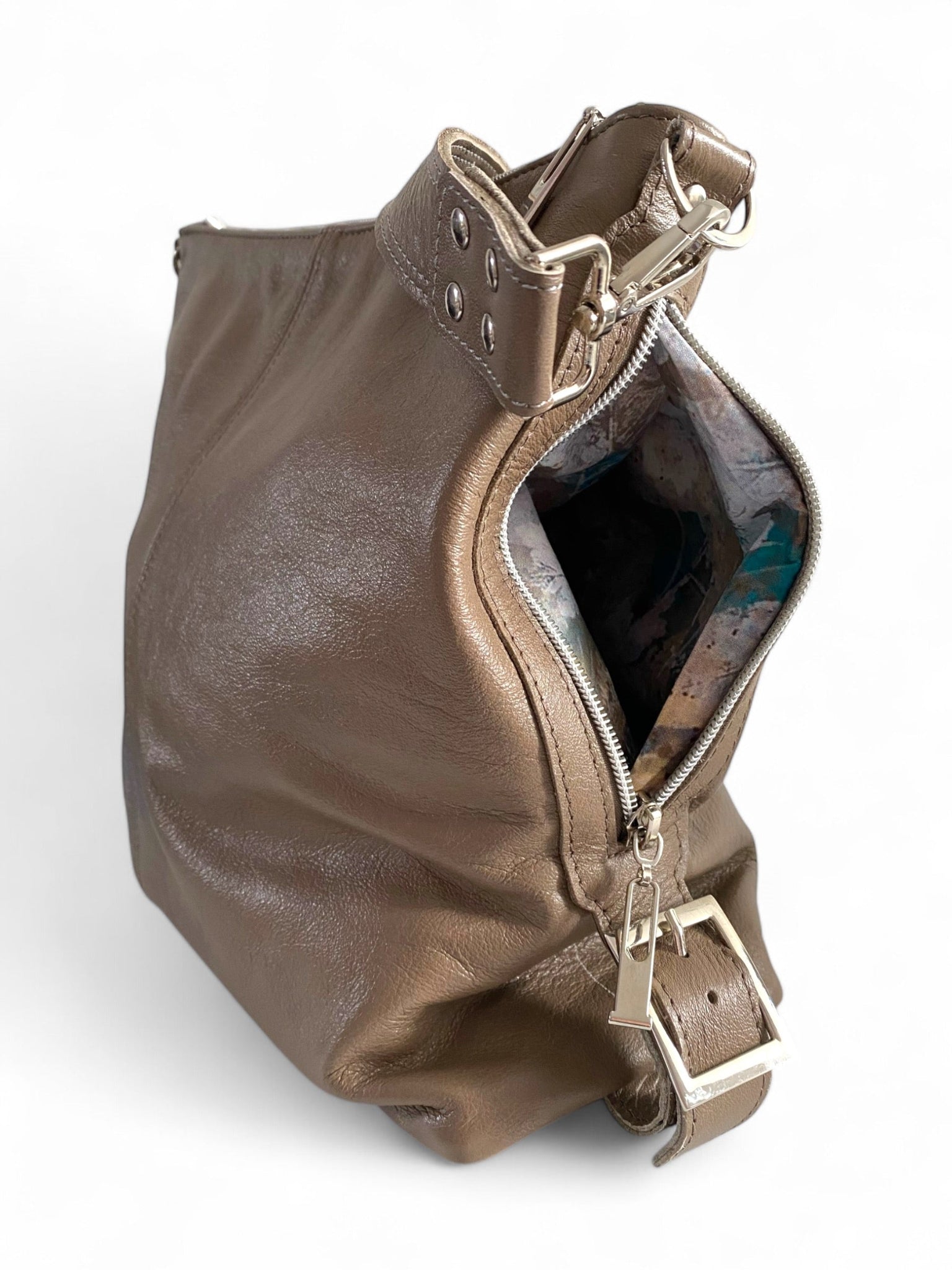 taupe leather bag with open zipper pocket on a white background