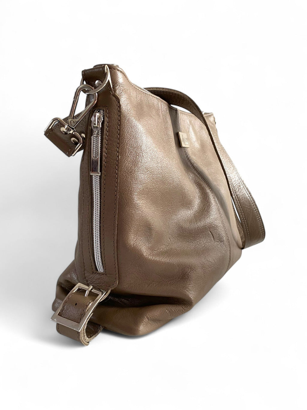 Taupe grey leather bag with a shoulder strap and silver hardware on a white background