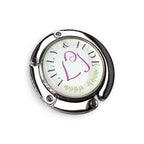 Round metal fold away bag hook with 'Lilly & Jude' branding on a white background