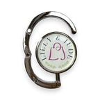 Folding handbag hook with 'Lilly & Jude' branding on a white background