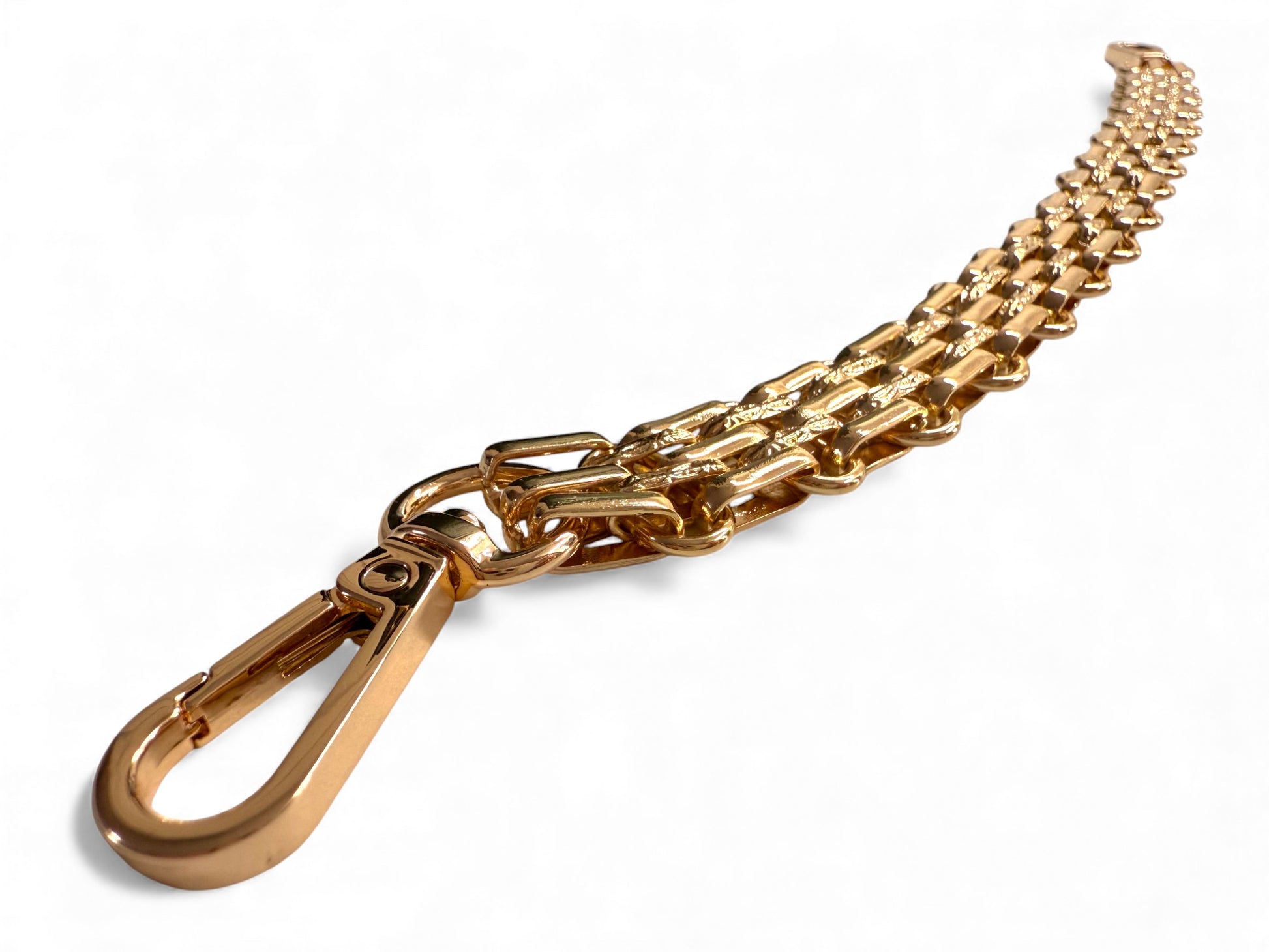 Gold chain with a carabiner on a white background