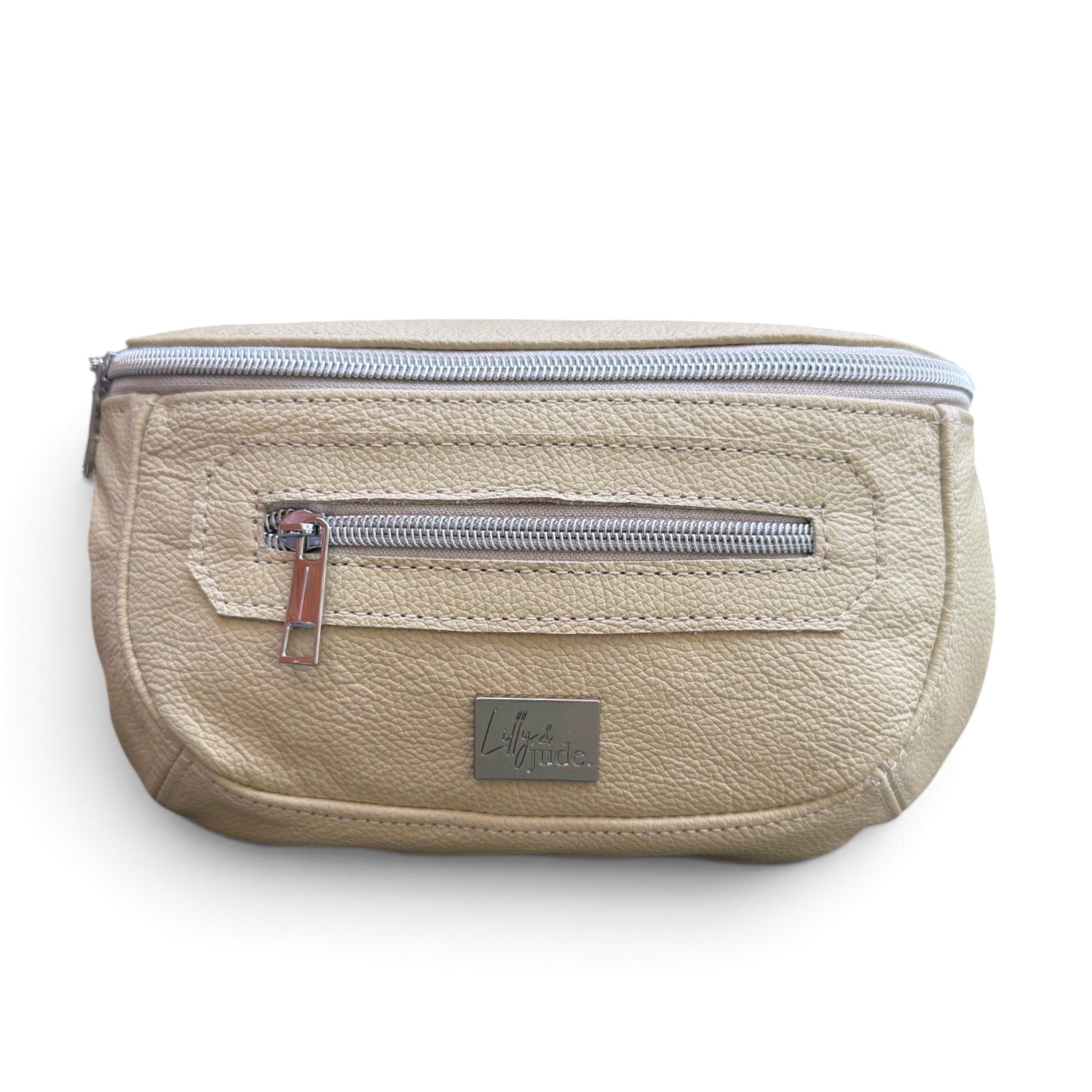 A cream, textured leather waist bag with a silver zipper and a small silver brand plaque on the front, shown against a plain white background.