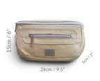 Cream coloured leather waist bag with silver zippers and dimension markings showing 15cm height, 24cm width, and 5cm depth on a white background.