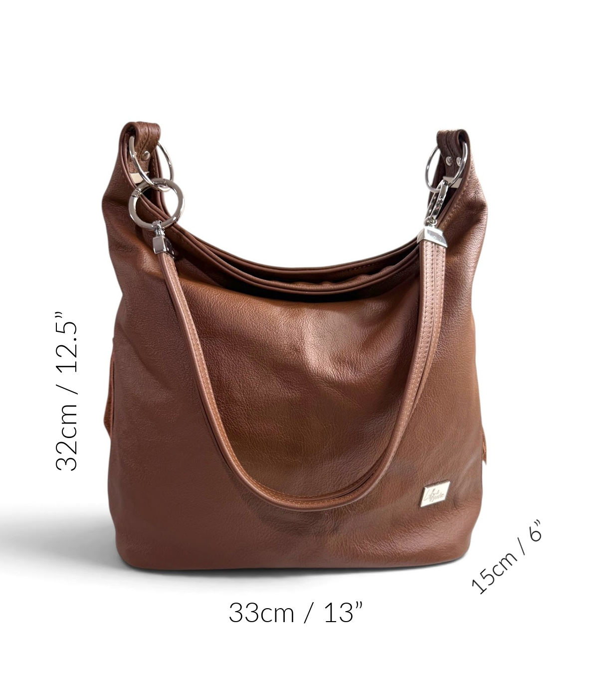 A brown leather slouchy bag shown on a white background with overlaid dimension labels indicating 32cm height, 33cm width, and 15cm depth.