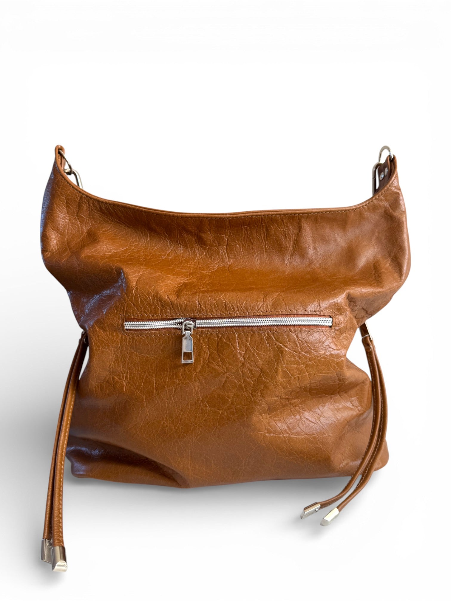 View of the rear of the tan coloured Simone slouchy tote bag, highlighting the spacious zipper pocket on the back 