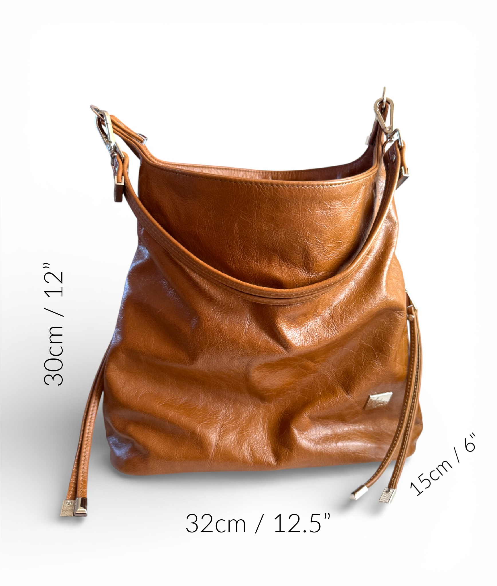 Tan brown, genuine leather, slouchy handbag with measurements on a white background
