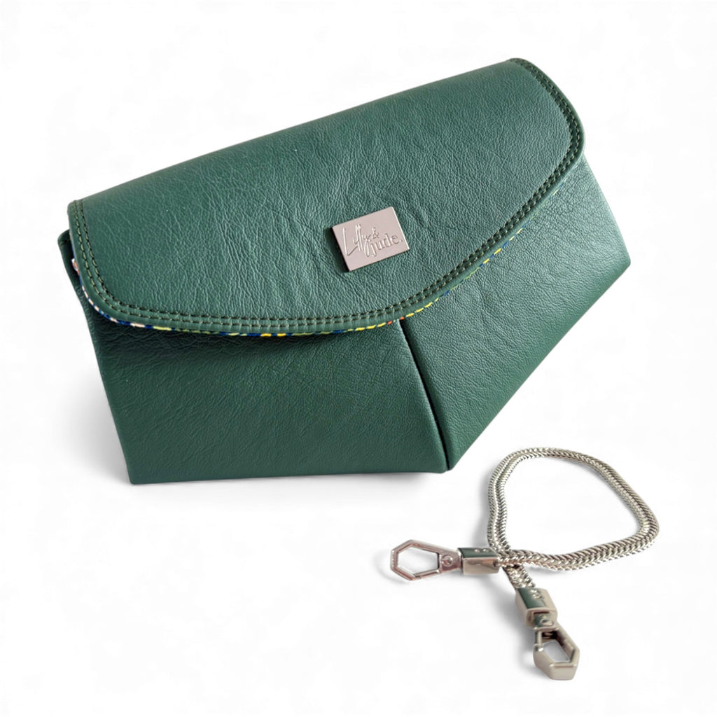 Green leather bag with a chain detail on a white background. Handcrafted by Kerry at Lilly & Jude in the UK
