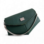 Dark green leather handbag with a short silver chain strap on a white background
