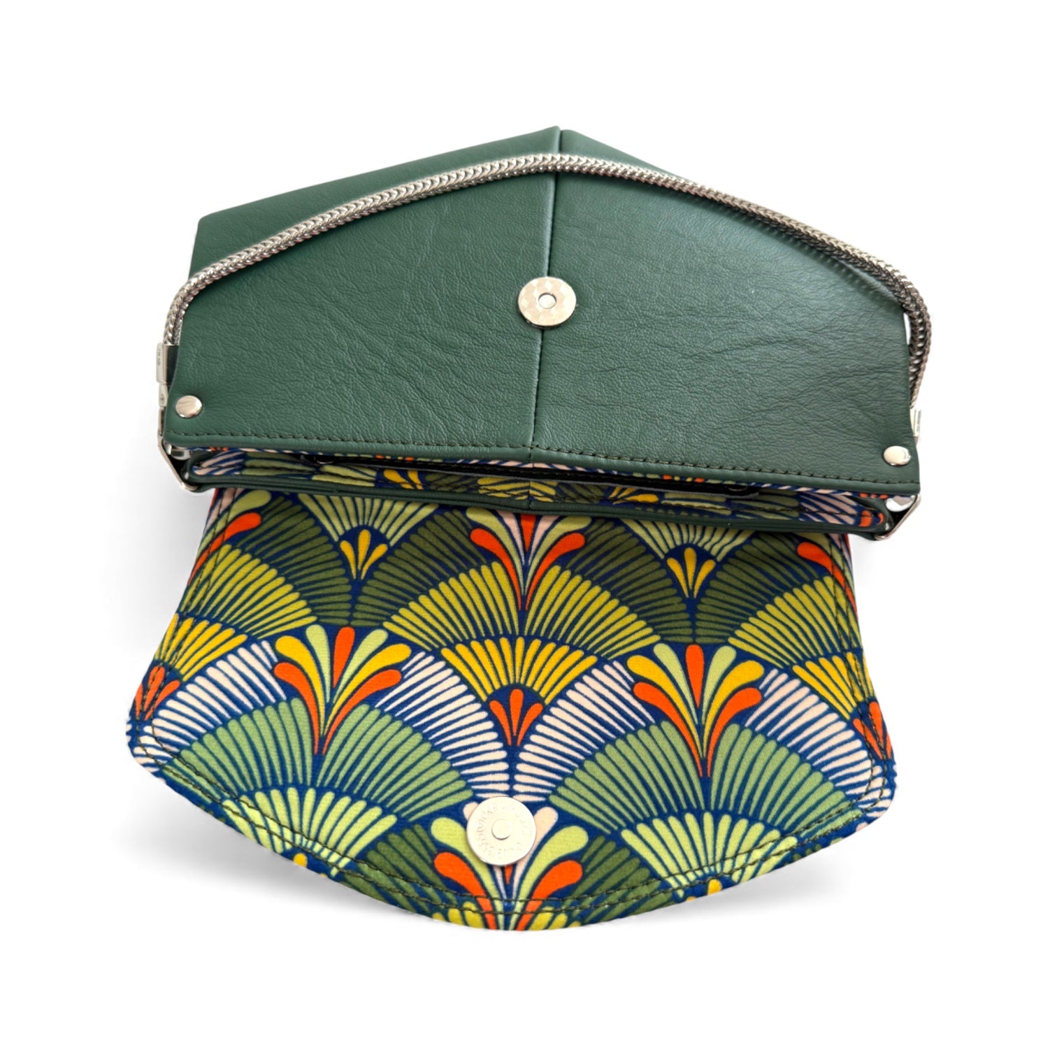Green leather clutch with a colorful geometric pattern on a white background