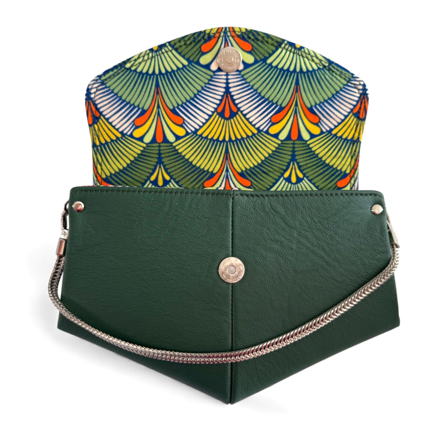 Dark, forest green bag with a bright, orange, yellow and green, fan patterned lining on a white background. 