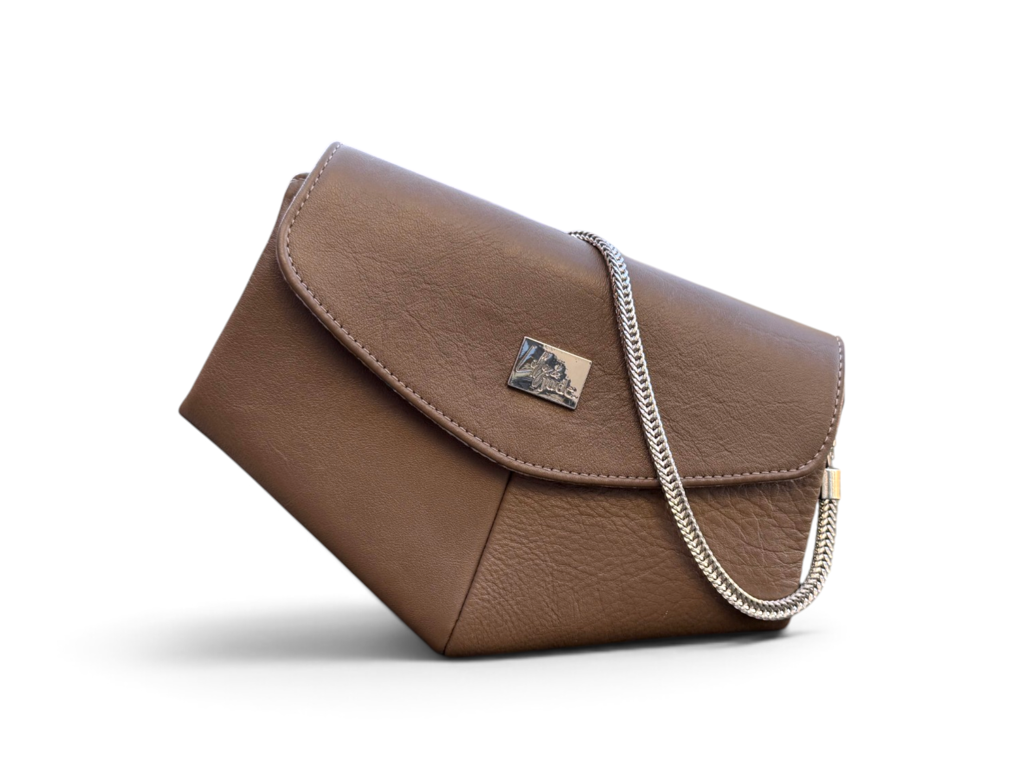 A mushroom brown textured leather shoulder bag with a silver chain strap and a small metallic logo plaque on the front flap, shown on a clean white background.