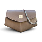 A taupe brown leather handbag with a silver chain strap and a silver-tone logo plate on the front flap, set against a plain white background.