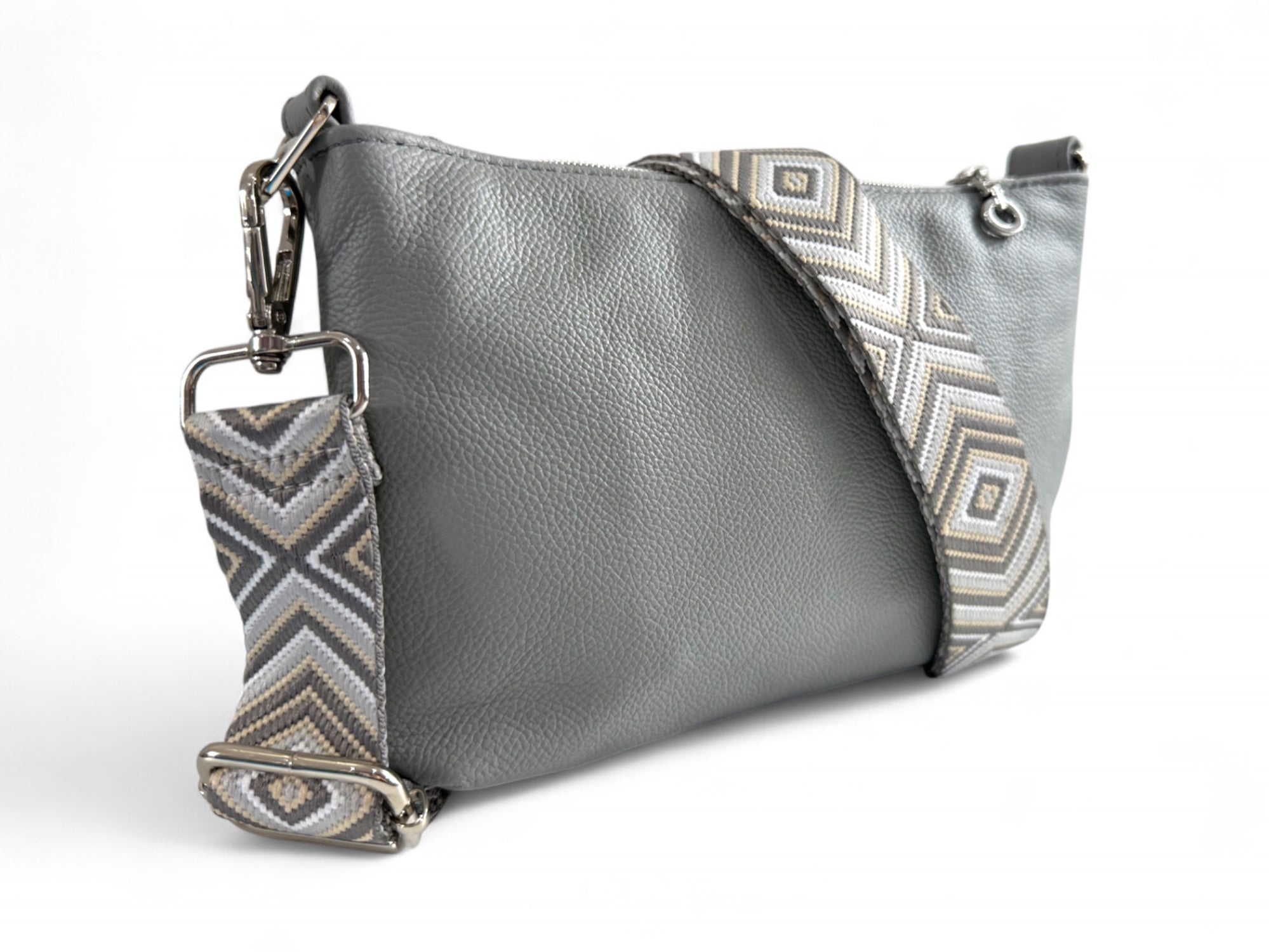 Rear view of the Starburn crossbody bag in pale grey leather and woven adjustable strap and silver hardware