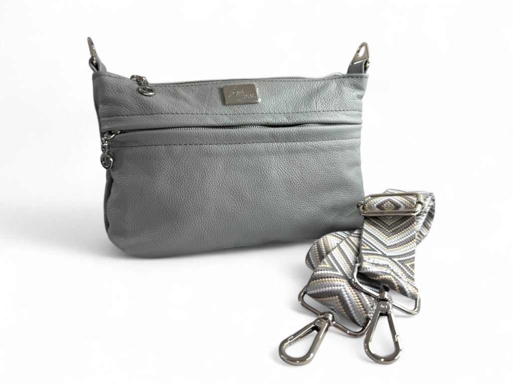Light gray genuine leather crossbody bag with a detachable strap on a white background