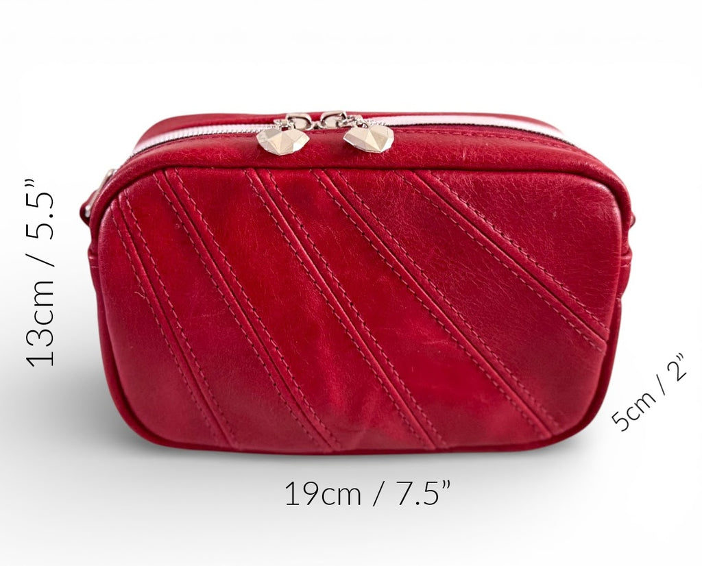 Tiny Harriet crossbody bag, made from red, rescued leather against a white background, with the dimensions denoted around the outside of the bag