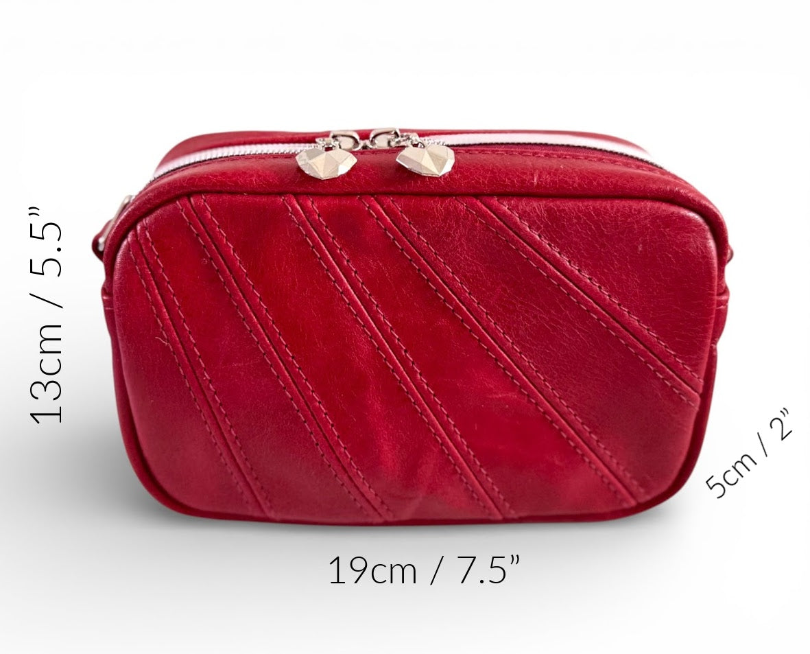 Tiny Harriet crossbody bag, made from red, rescued leather against a white background, with the dimensions denoted around the outside of the bag