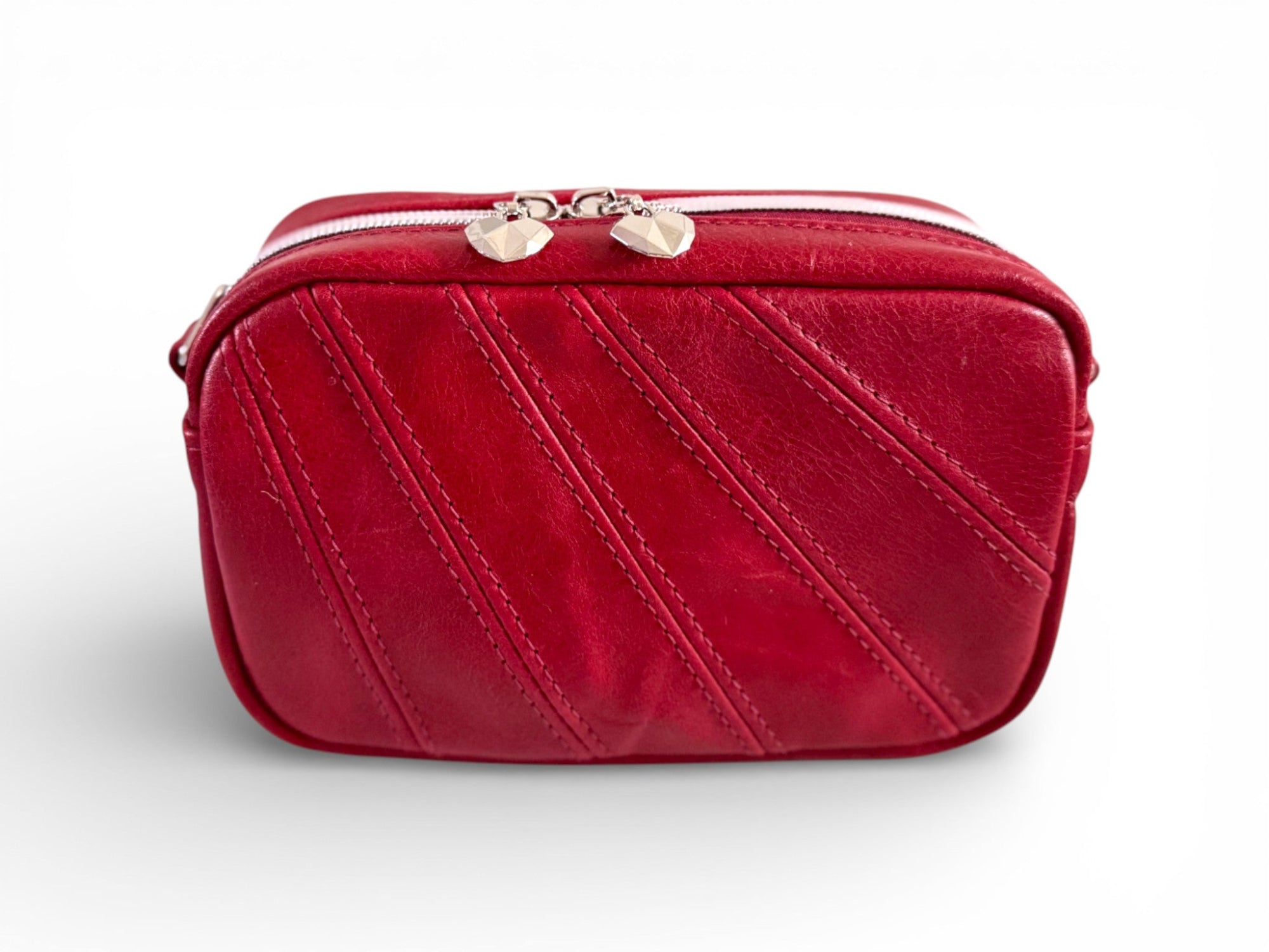 Handmade red leather compact crossbody bag with silver zipper on a white background