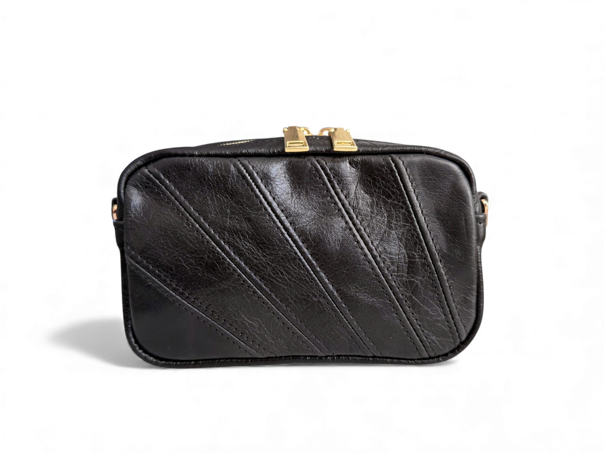Black leather panelled crossbody handbag with gold zip on a white background