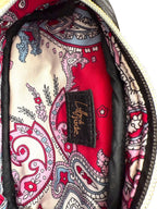 Close-up of the patterned lining fabric with a visible brand label inside a bag.