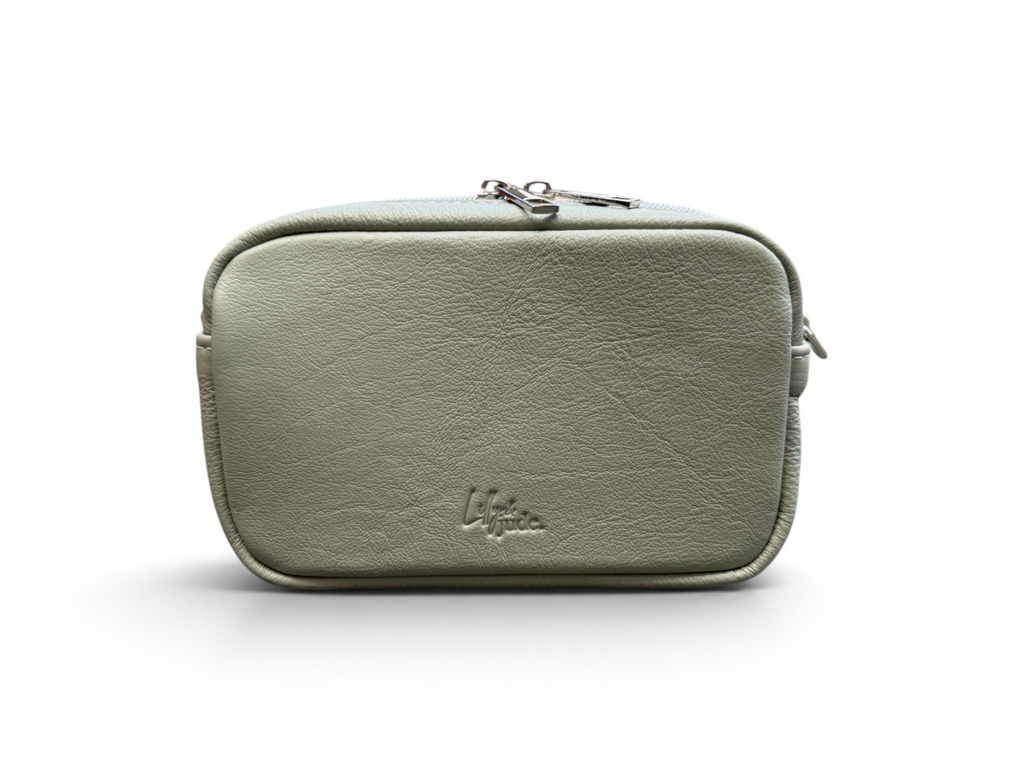 A sage green faux-leather zippered pouch with a embossed 'Lilly & Jude' logo on the front, shown on a clean white background.