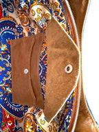Interior view of the Veronica handbag, showing a close-up of the leather integrated purse and a colorful patterned fabric lining