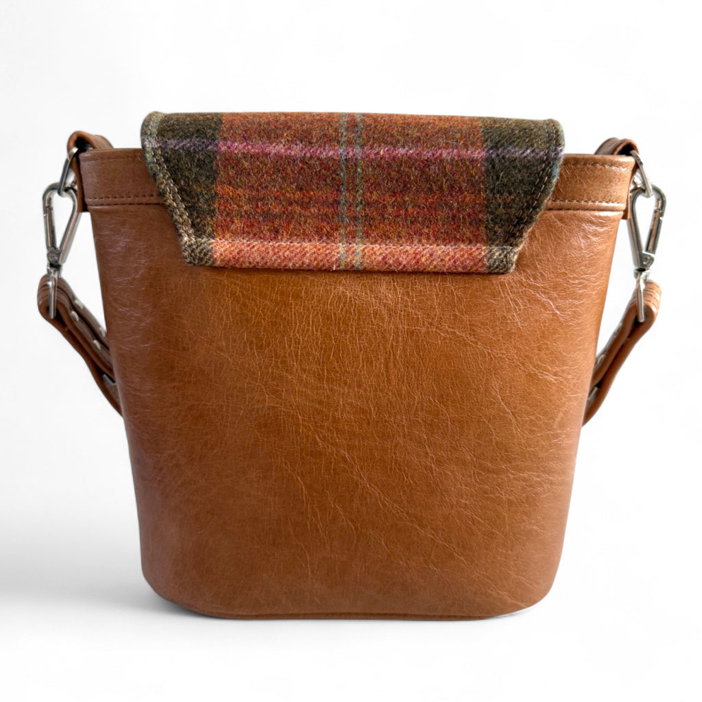 View of the back of the Belle showing tweed detail and back structure. The bag is on a white background
