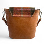 View of the back of the Belle showing tweed detail and back structure. The bag is on a white background

