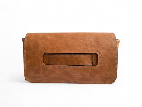 Tan Brown leather clutch bag, with hand strap on a white background. 