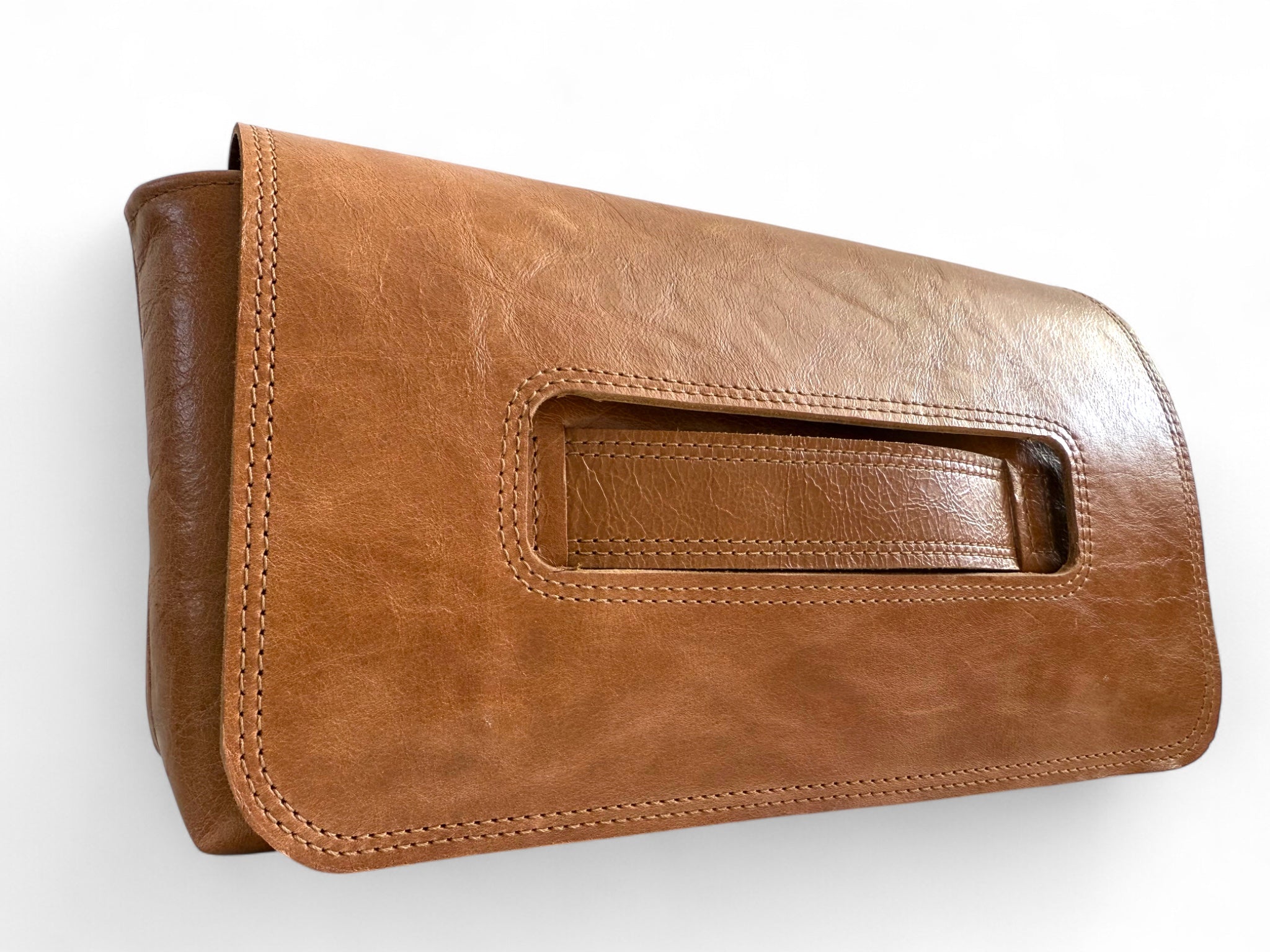 Bronte East/West Clutch bag, hand crafted using genuine tan coloured rescued leather, against a white background