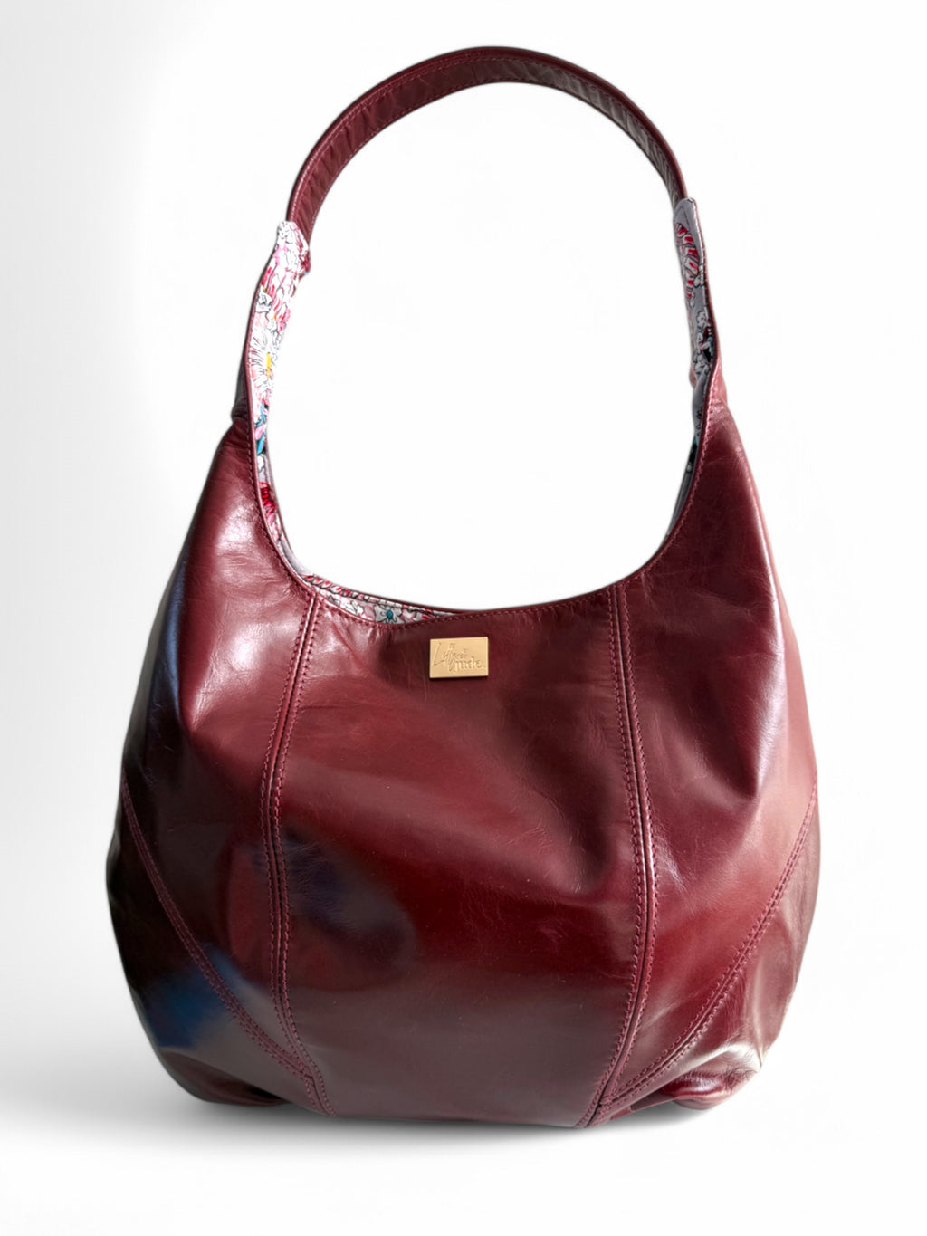 Real leather slouchy handbag in burgundy on a white background