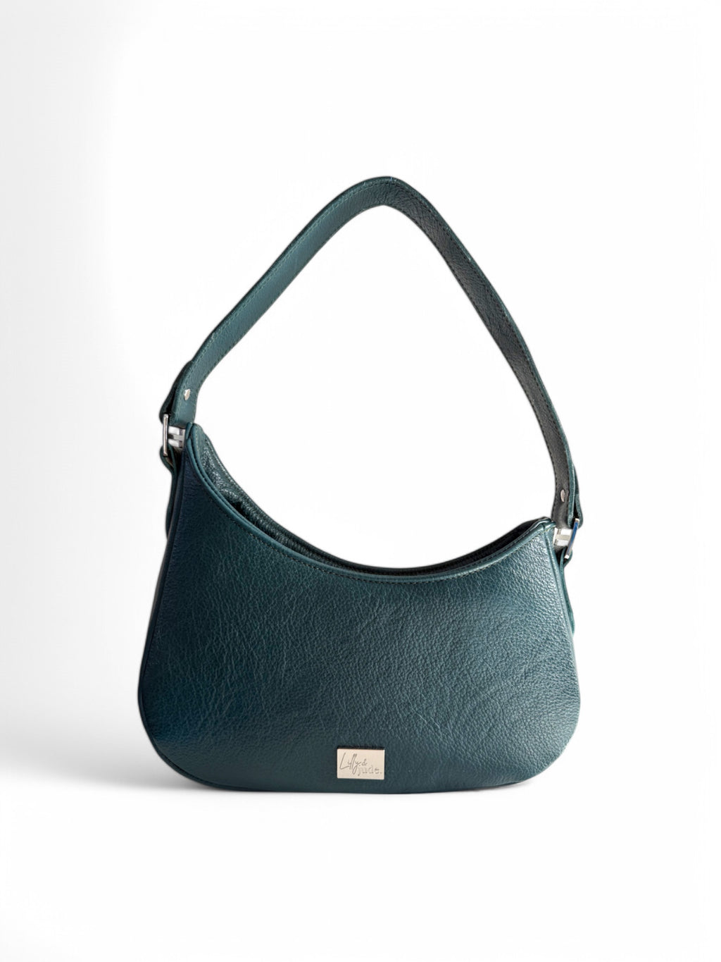 A teal leather shoulder bag with an asymmetric design, featuring a fixed strap and a zipper closure. The bag is displayed against a neutral background.