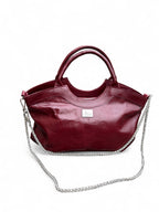 Maroon handbag with a chain detail on a white background