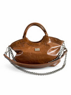 Tan brown slouchy baguette bag made from recycled leather with silver hardware