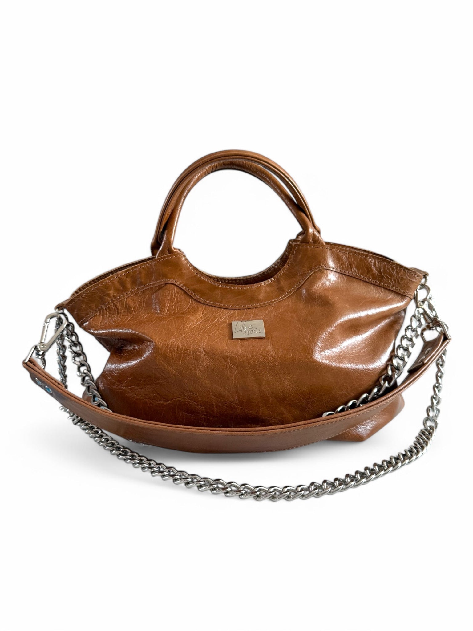Tan brown slouchy baguette bag made from recycled leather with silver hardware