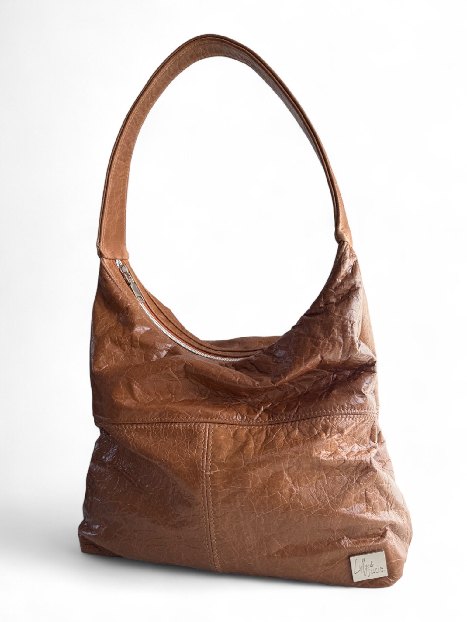 Brown leather handbag on a white background
