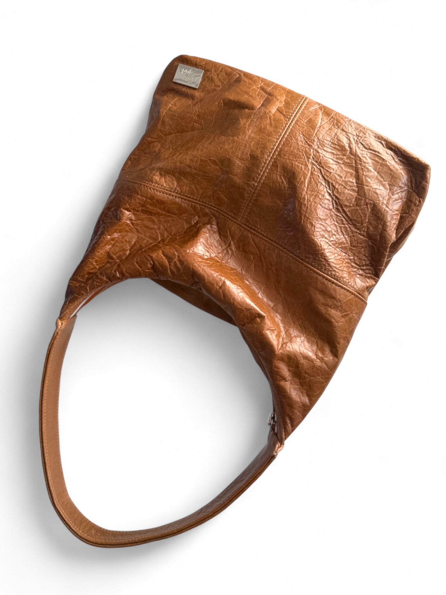 Brown leather slouchy shoulder bag on a white background