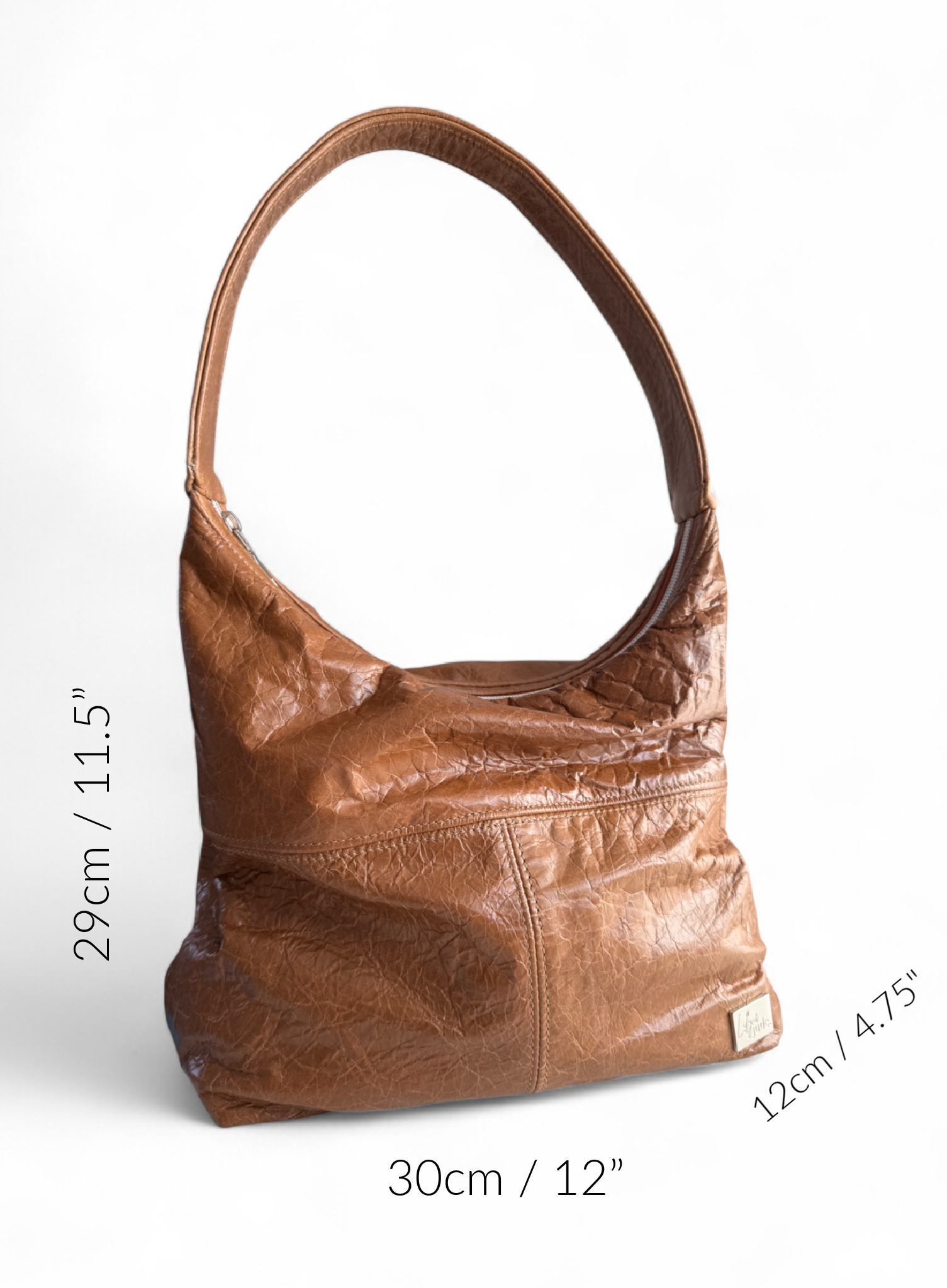 Brown slouchy leather handbag with measurements on a white background