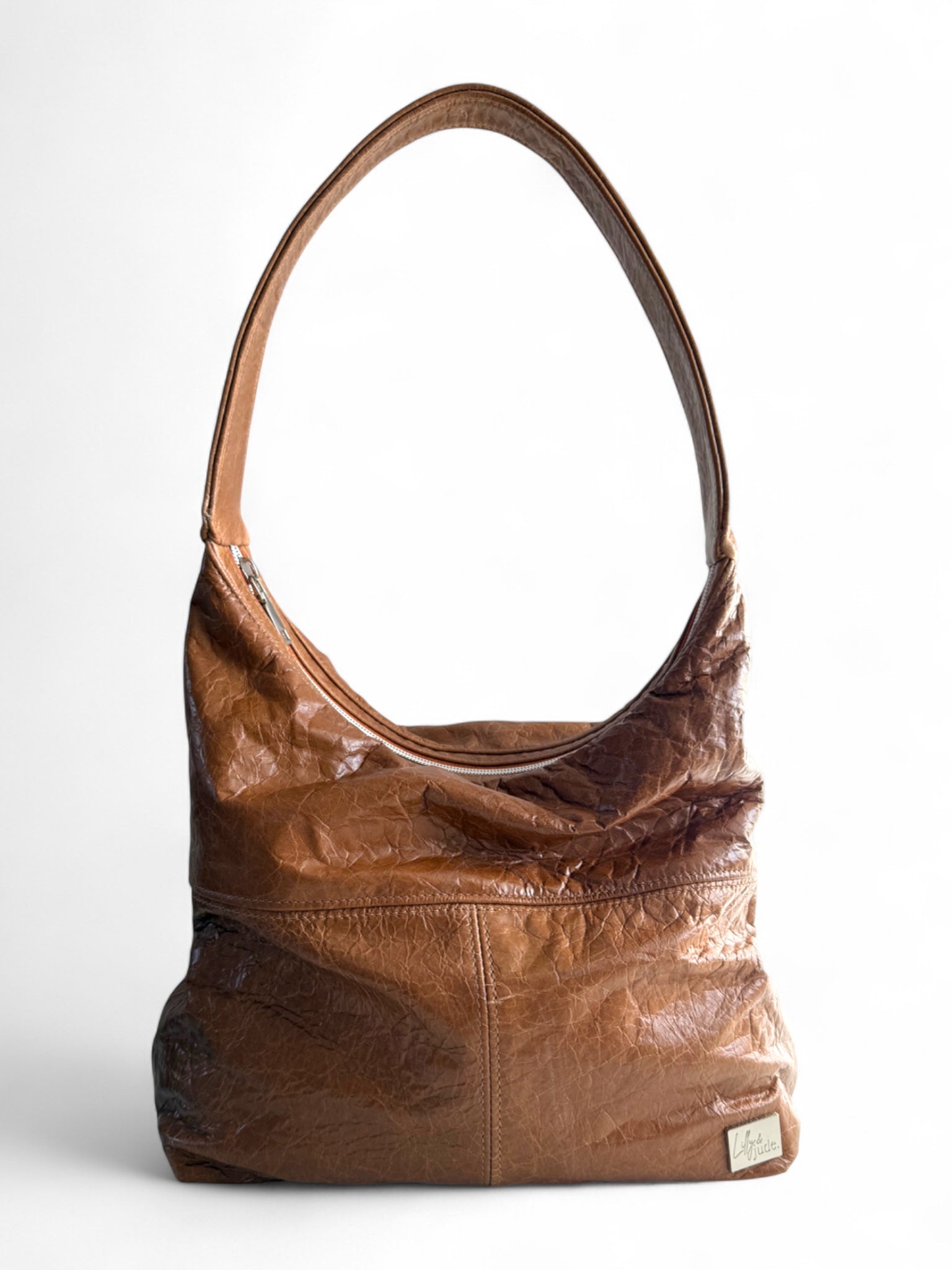 Brown leather handbag on a white background