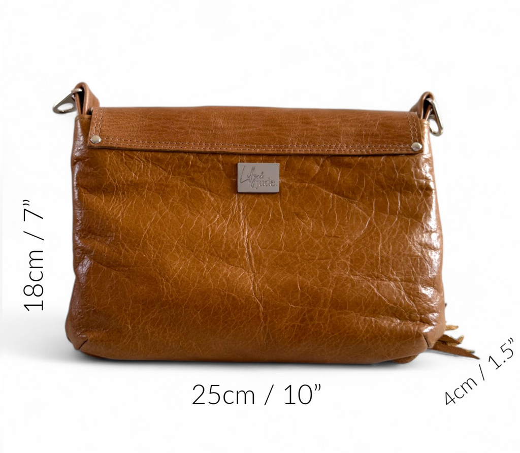 Tan coloured leather crossbody bag, against a white background, with the measurements of the bag noted around it.